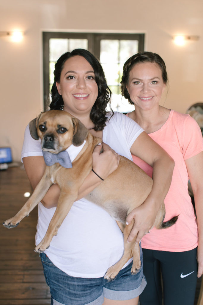 LGBTQ Brides getting hair and make up done together with their dog present