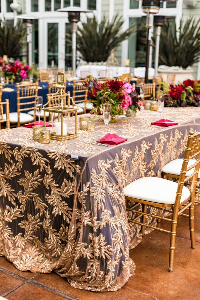 Colorful outdoor Indian wedding reception with florals and lanterns in Monterey CA