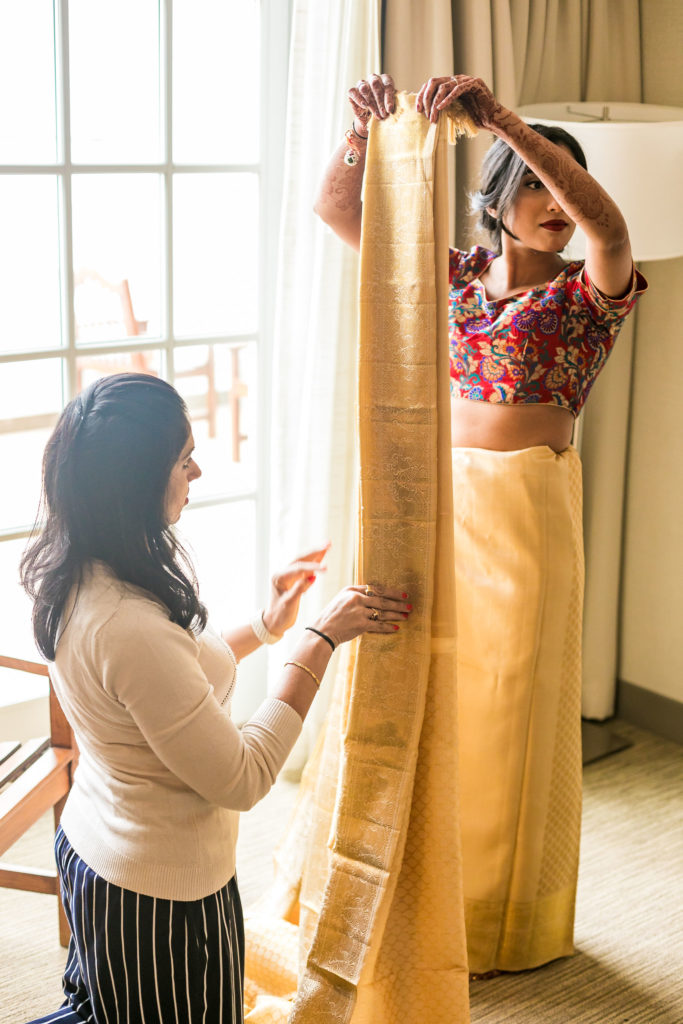 Indian Bride getting in Sari for her wedding ceremony