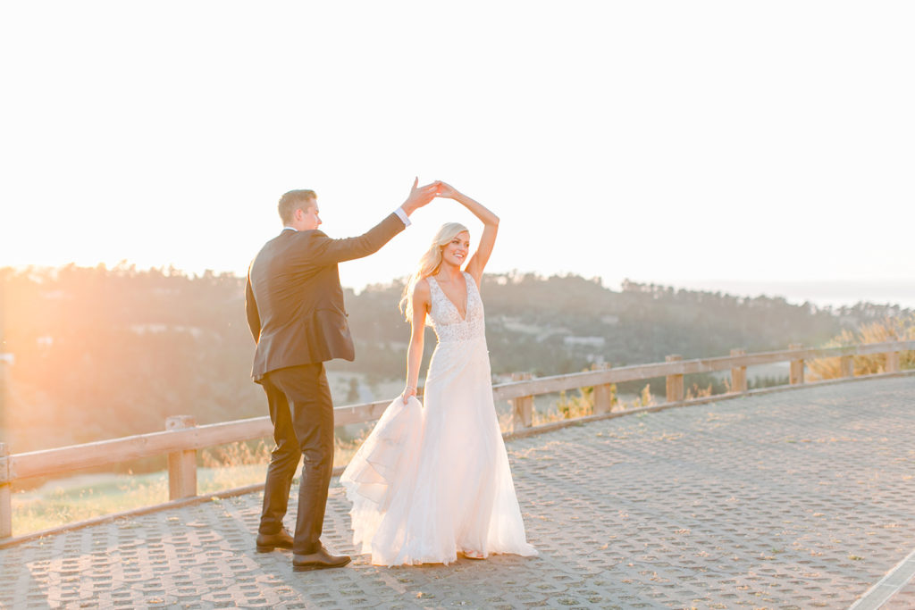 Bride and Groom dancing in the golden light of sunset in carmel california