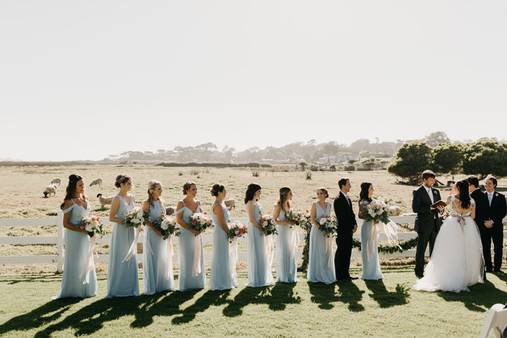 Bridesmaids lined up for the ceremony at Carmel Mission Ranch in Carmel CA