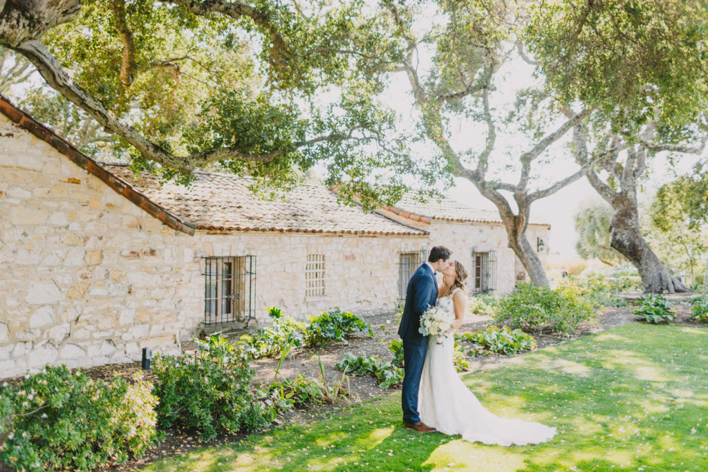 Couple kissing after first look at Holman Ranch 