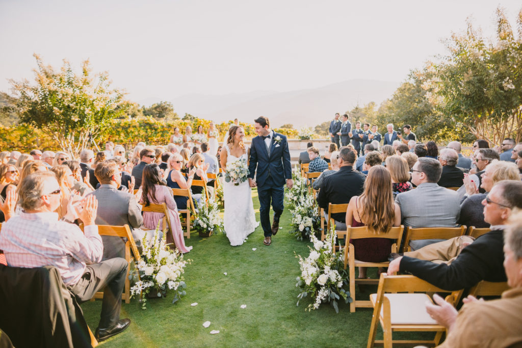 Couple recessing from their ceremony