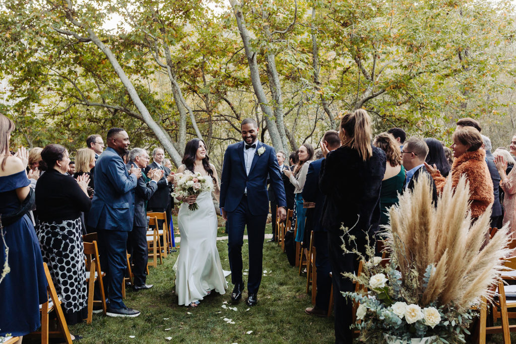 Bride and Groom Walking Down the Aisle